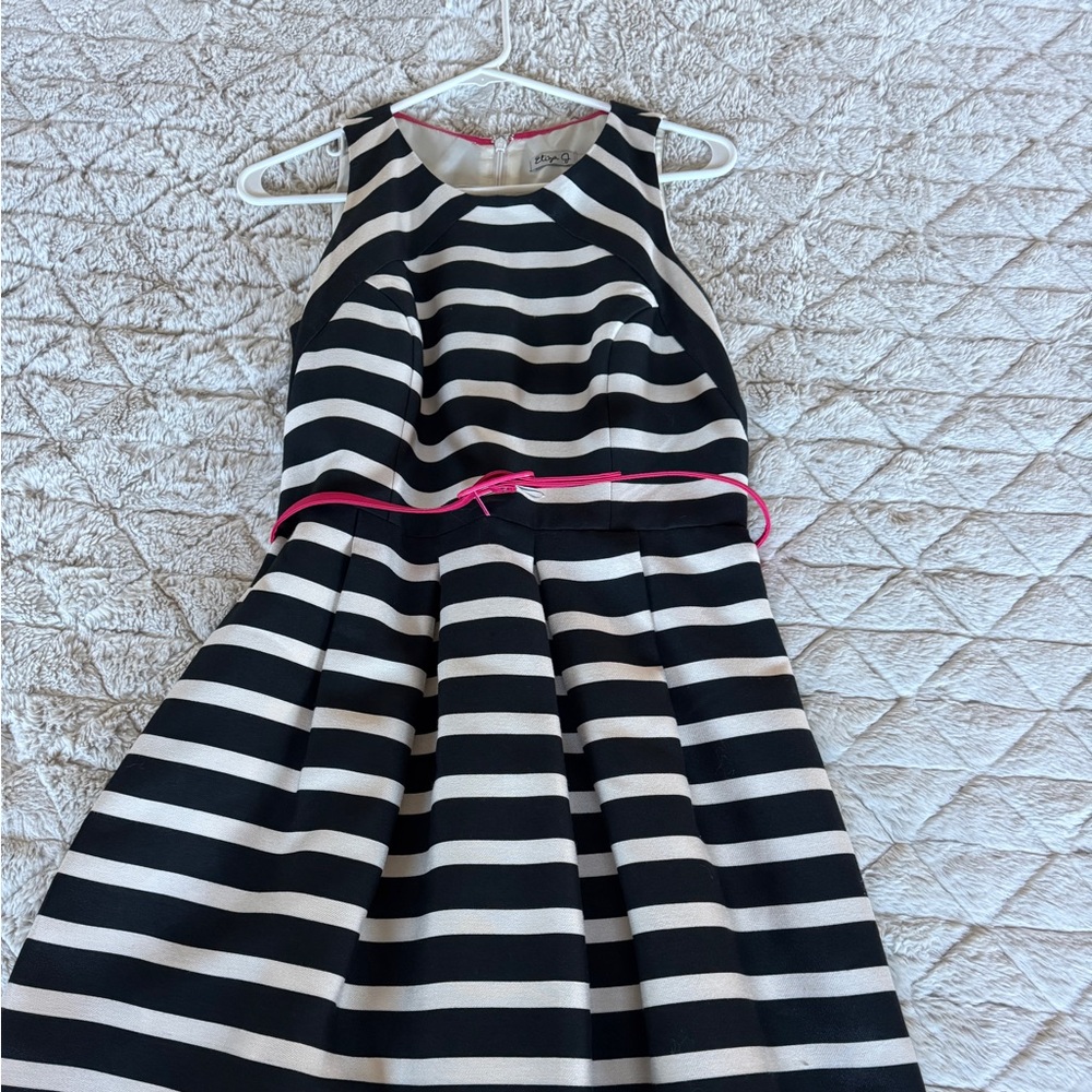 Eliza J size 8 black, and cream, striped dress with fuchsia colored belt ￼